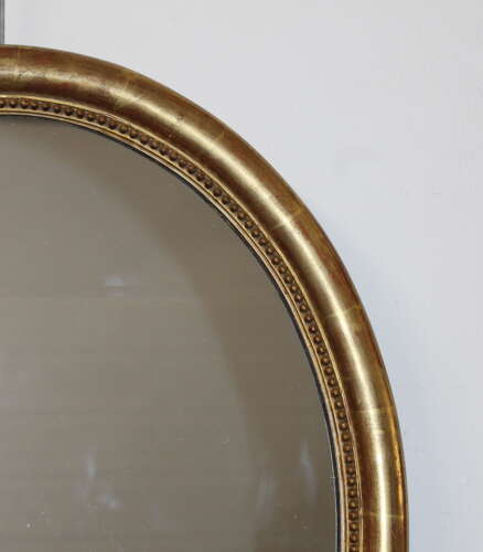Antique French watergilt framed oval mirror