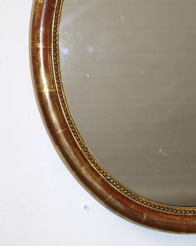 Antique French watergilt framed oval mirror