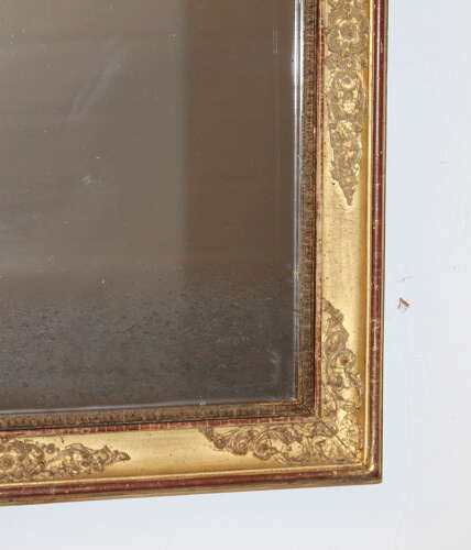 Small antique French gilt mirror with decorative frame