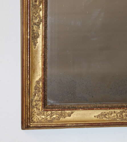 Small antique French gilt mirror with decorative frame