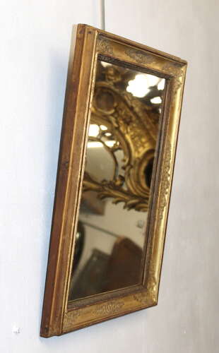 Small antique French gilt mirror with decorative frame