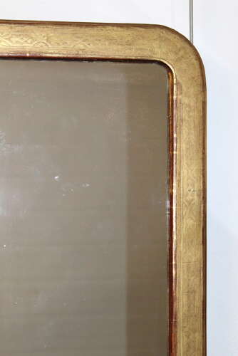 Exquisite Antique French etched gilt mirror with curved corners