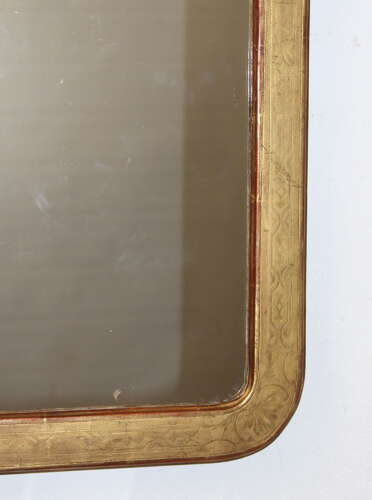 Exquisite Antique French etched gilt mirror with curved corners