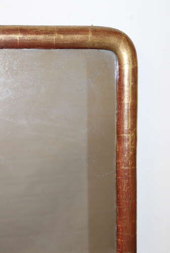 Narrow antique French archtop mirror with watergilt frame