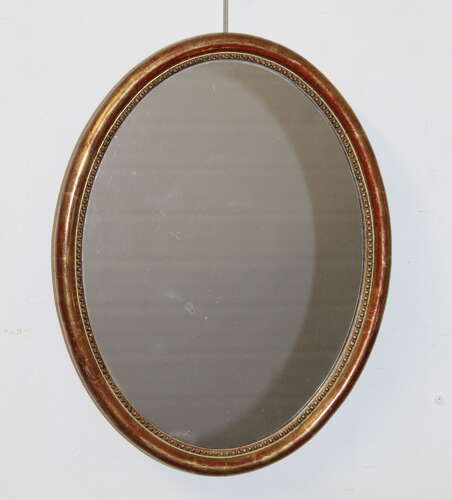 Antique French oval mirror with narrow watergilt frame