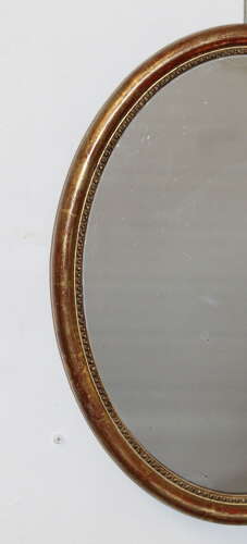 Antique French oval mirror with narrow watergilt frame