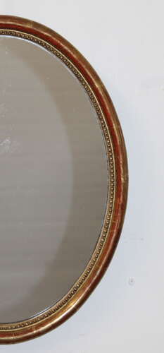 Antique French oval mirror with narrow watergilt frame