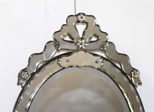 Antique oval Venetian mirror with bow