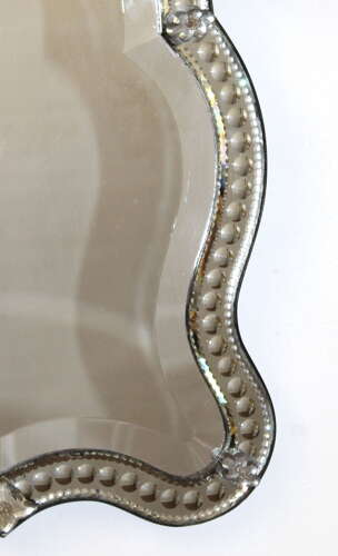 Small antique curvy Venetian mirror with bow