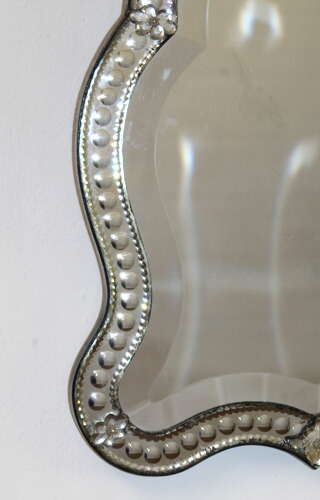 Small antique curvy Venetian mirror with bow