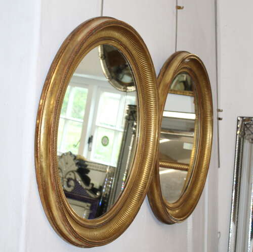 Handsome pair of large antique French oval mirrors