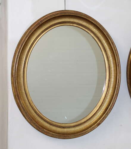 Handsome pair of large antique French oval mirrors