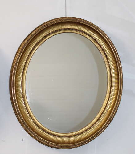 Handsome pair of large antique French oval mirrors