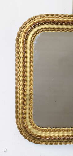 Small antique French mirror with rippled gilt frame