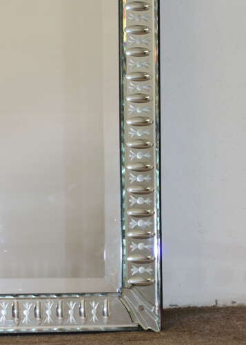 Elegant narrow antique Venetian mirror with serpentine top