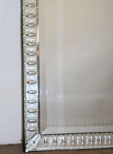 Elegant narrow antique Venetian mirror with serpentine top
