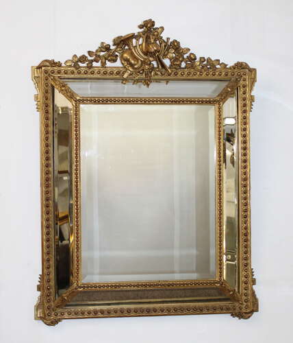 Antique French gilt decorative cushioned mirror