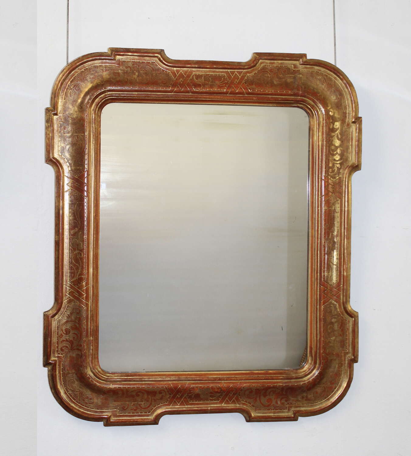 Large antique Italian mirror with outset corners