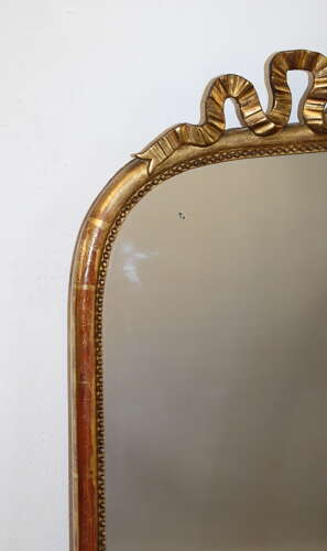 Antique French arched mirror with bow cartouche