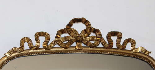 Antique French arched mirror with bow cartouche