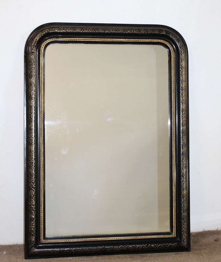 Antique French archtop mirror with black and gold frame