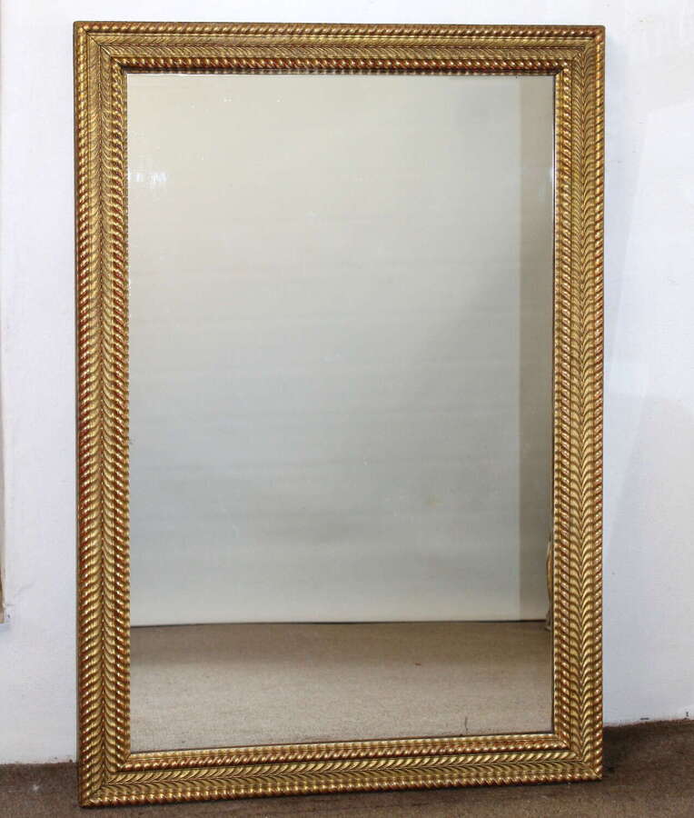 Antique French mirror with gilt rippled frame